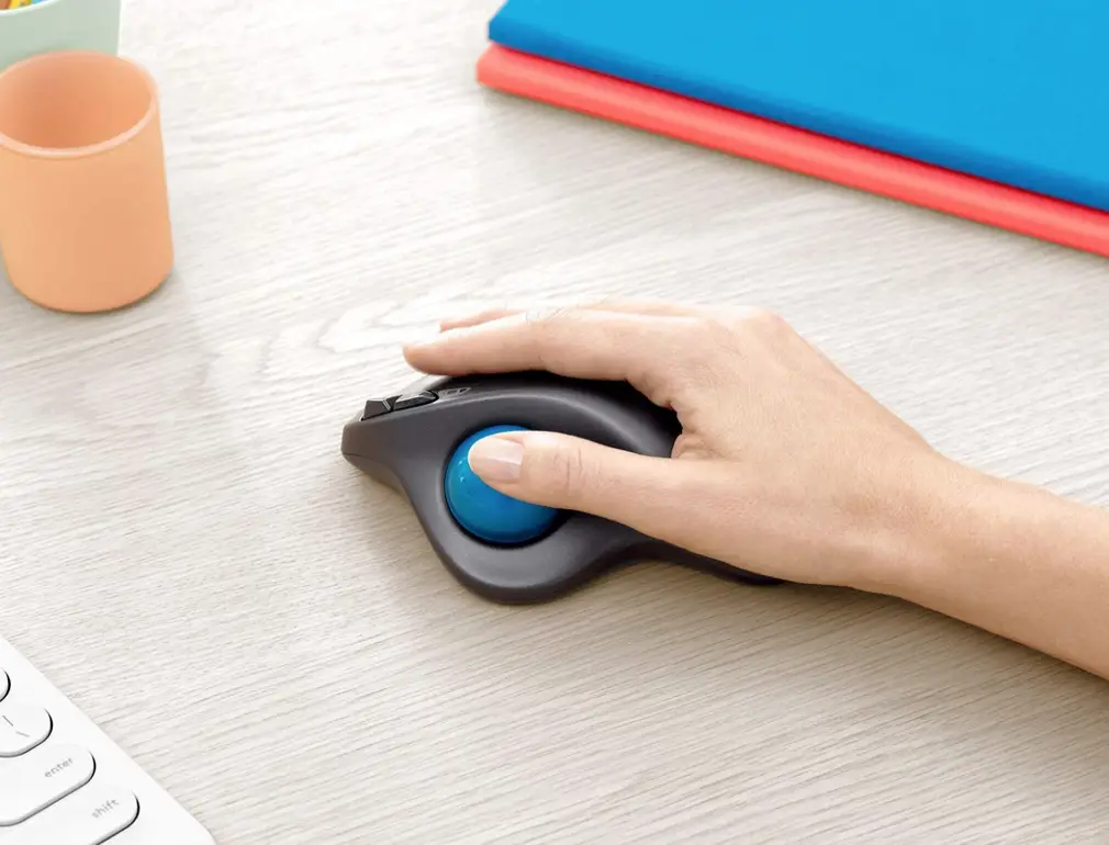 Logitech M570 Wireless trackball mouse on desk ergonomically office products