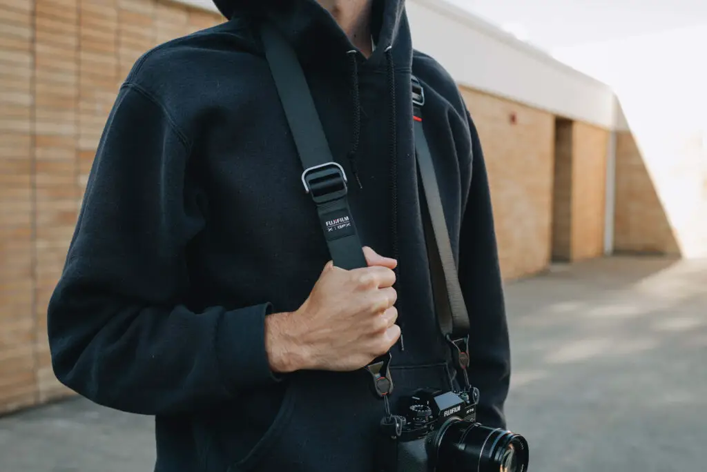 The Slide Lite Mirrorless Camera Sling Strap in use.