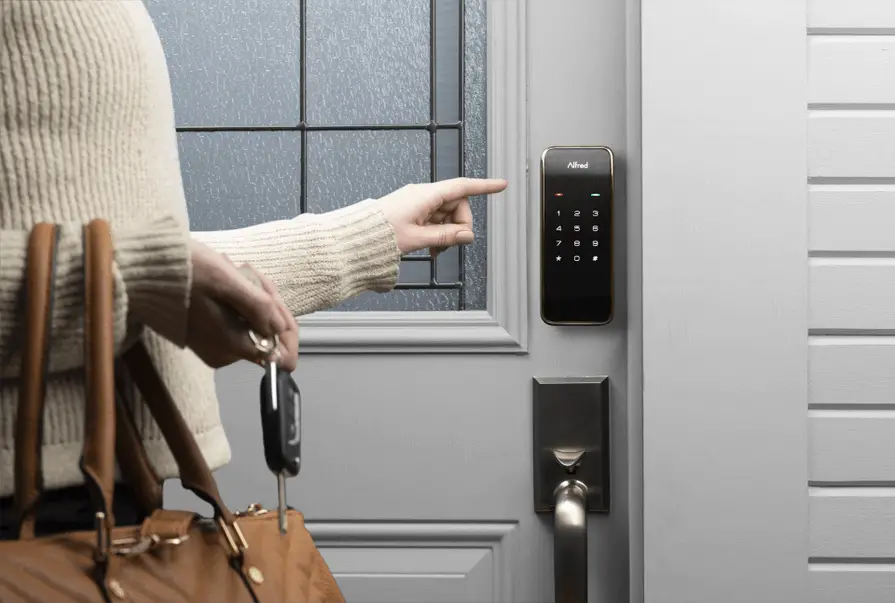 A woman entering in her house using the Alfred smart lock.