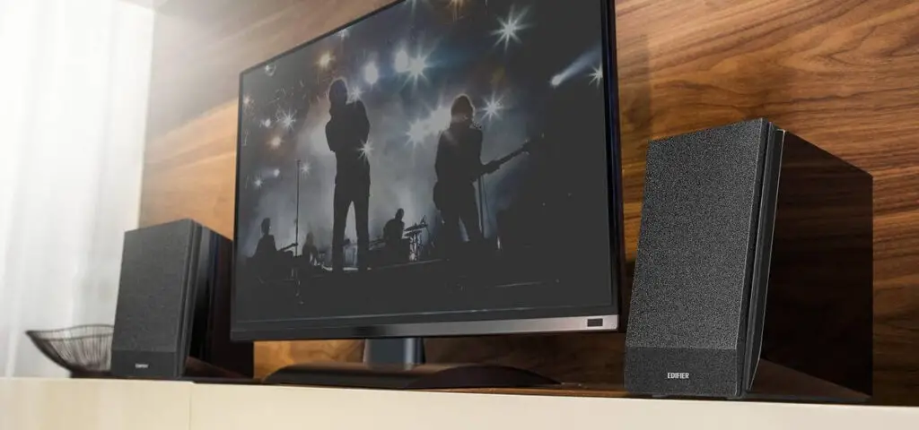 Edifier's R1850DB bookshelf speakers on a shelf on either side of the television set.
