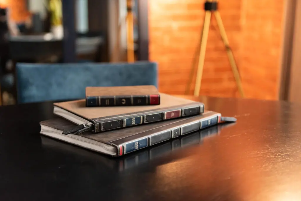The Twelve South BookBook iPad cases stacked on a table.