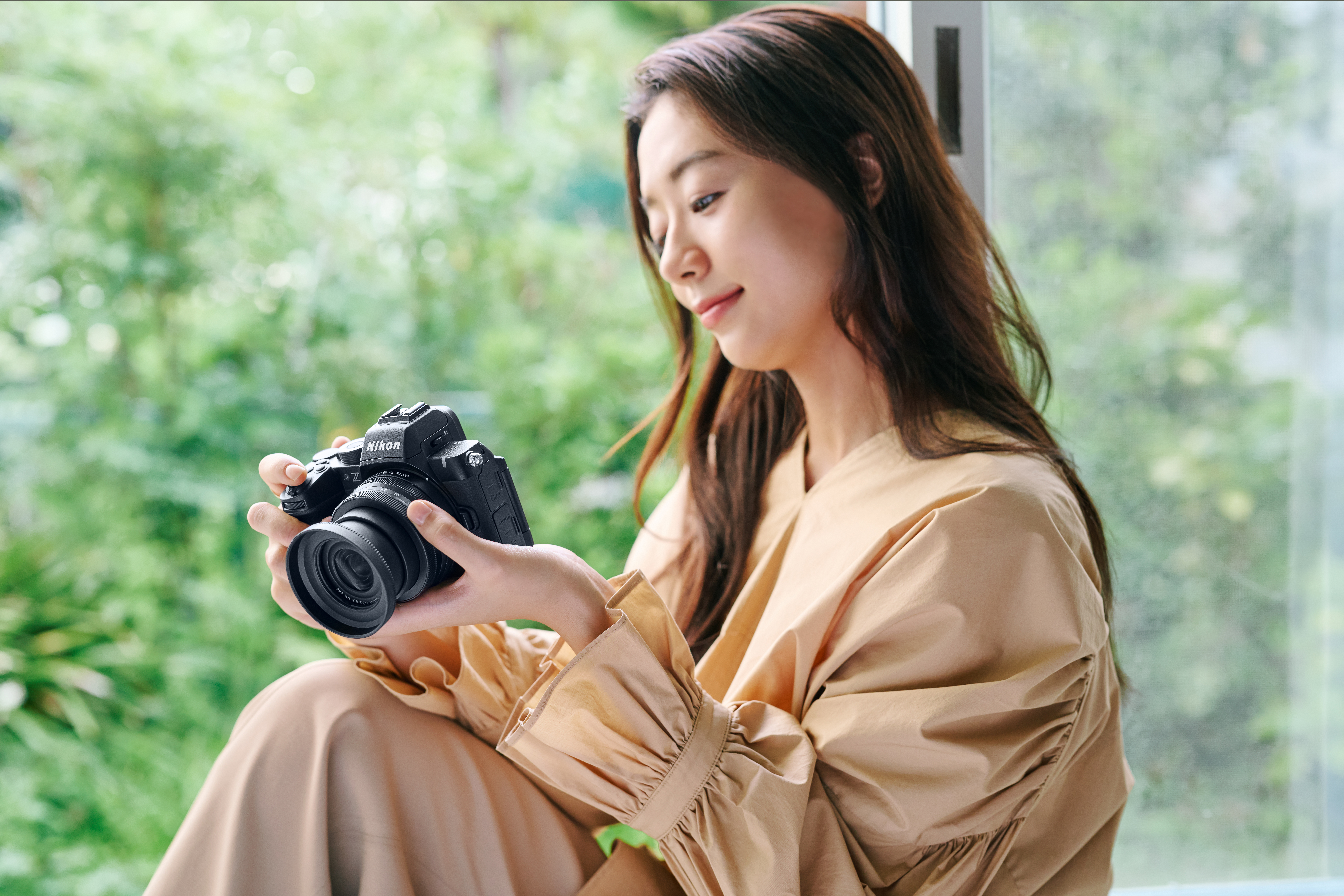 Current image: Nikon Z50 II camera with user