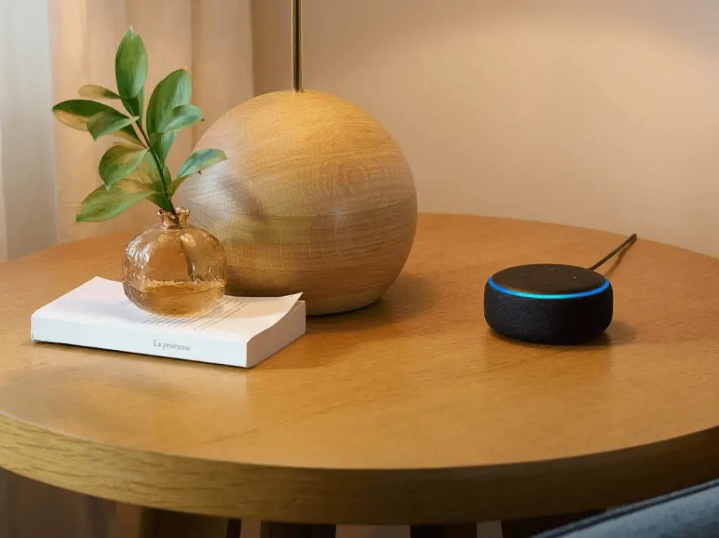 The Amazon Echo Dot sitting on a table.