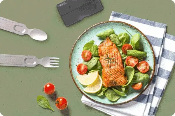 A tasty plate of salmon salad with the GoSun flatware in use on the table beside it.
