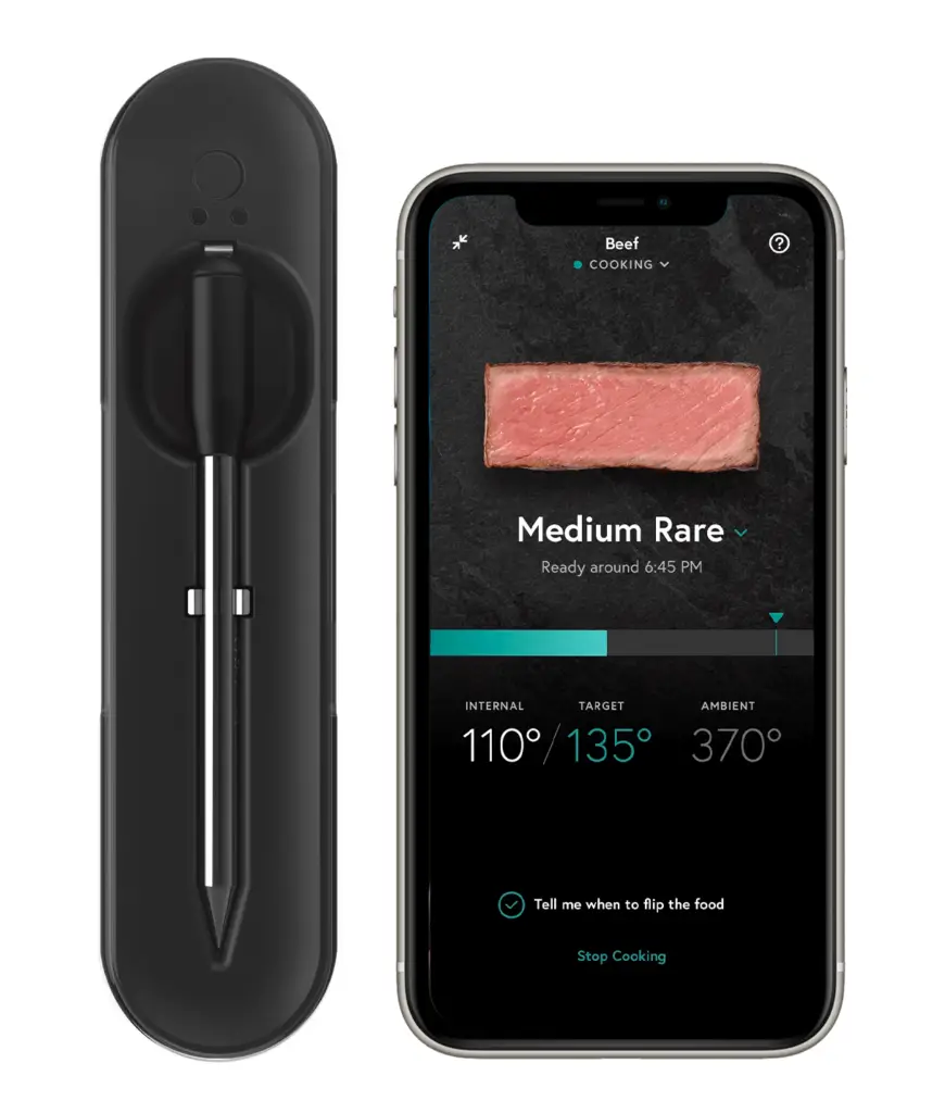 The Yummly Smart Thermometer  on display alone with the app on a phone.