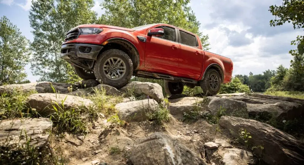 The 2021 Ford Ranger scaling a pile of boulders.