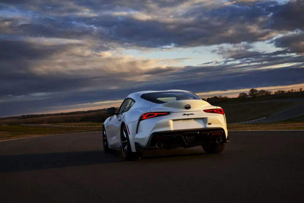 The 2021 Toyota GR Supra 3.0 Premium parked during a sunset.