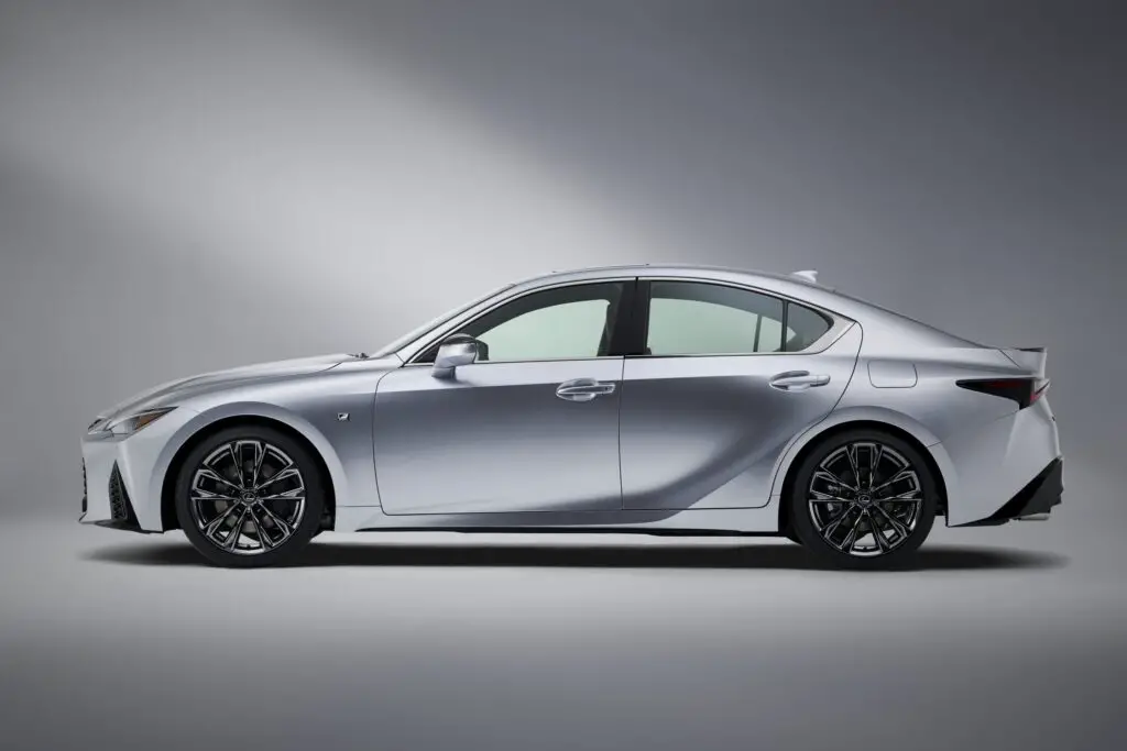 A silver 2021 Lexus IS 350 on a gray toned background