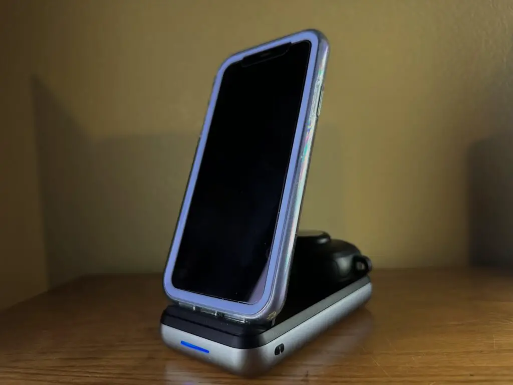 iPhone on charger stand with Airpods Pro